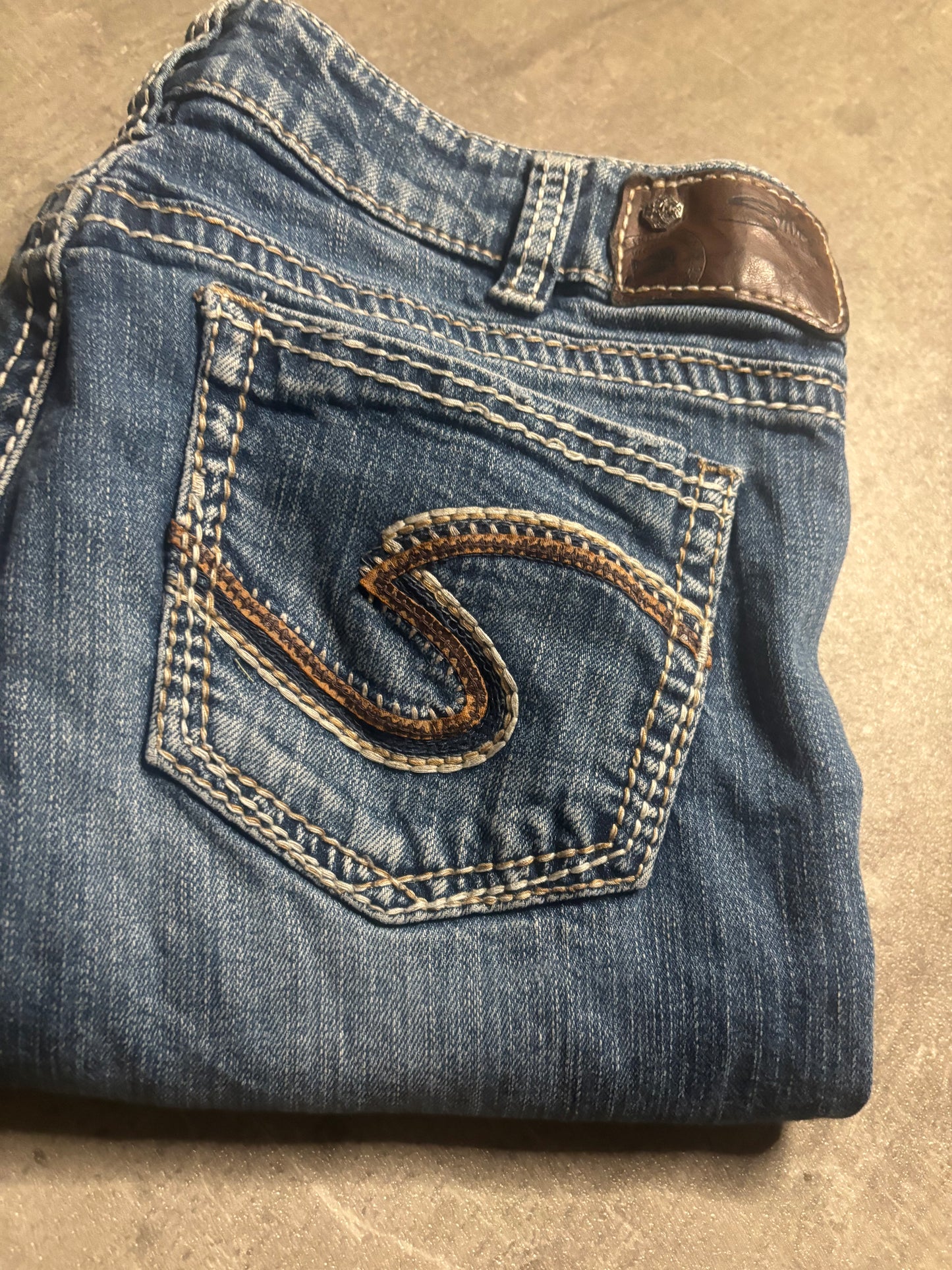 Silver bootcut jeans / M